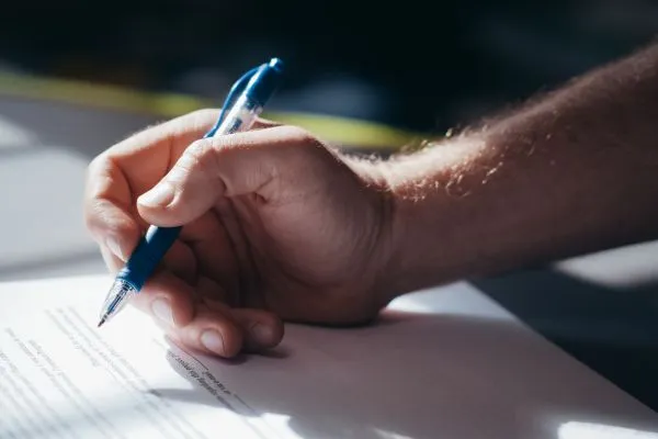 Person signing documents for residency